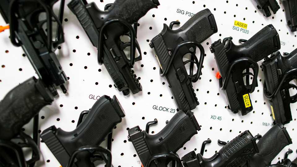 Guns are displayed at Shore Shot Pistol Range gun shop in Lakewood Township, New Jersey, US, March 19, 2020.