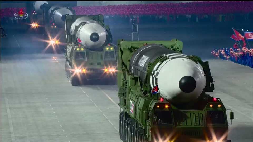 A screen grab taken from a KCNA broadcast on October 10, 2020 shows what appears to be new North Korean intercontinental ballistic missiles during a military parade