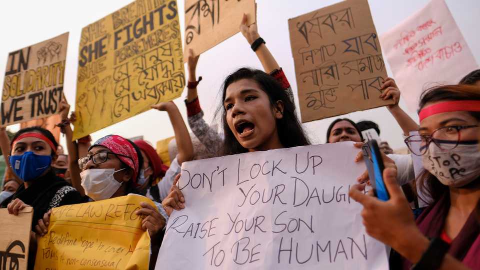 Rights activists and others protest against gender-based violence outside the parliament in Dhaka, Bangladesh, October 9, 2020.