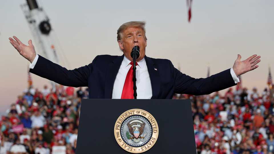US President Donald Trump speaks during a campaign rally, at Orlando Sanford International Airport in Sanford, Florida, US, October 12, 2020.