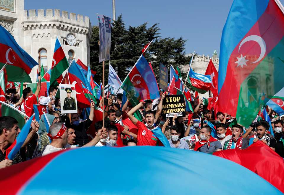 Demonstrators shout slogans as they wave Azerbaijani flags during a protest against Armenia, in Istanbul, Turkey, October 4, 2020.