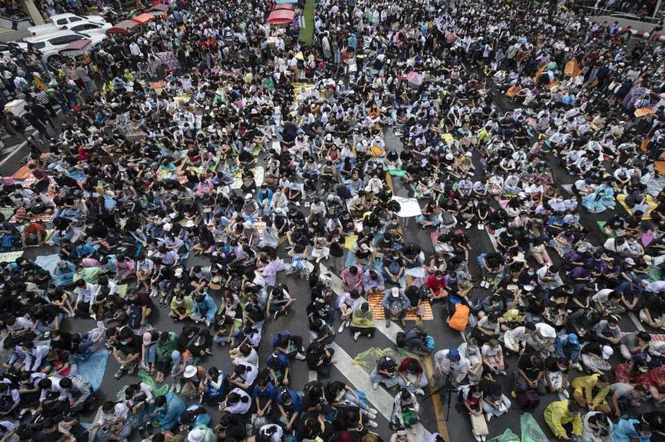 Hundreds of pro-democracy protesters gather in a business district in Bangkok, Thailand, Friday, Oct. 16, 2020. Thailand’s prime minister has rejected calls for his resignation as his government steps up efforts to stop student-led protesters from rallying in the capital for a second day in defiance of a strict state of emergency.