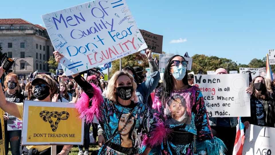 Women's March activists participate in a nationwide protest against US President Donald Trump's decision to fill the seat on the Supreme Court left by the late Justice Ruth Bader Ginsburg before the 2020 election, in Washington, October 17, 2020.