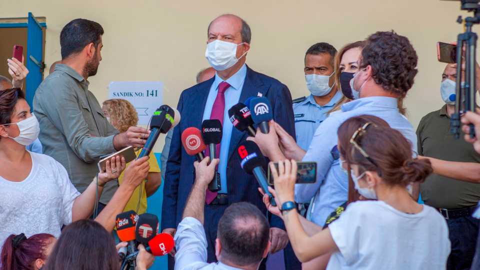 Prime Minister of Turkish Republic of Northern Cyprus (TRNC) Ersin Tatar speaks to the press after casting ballot during the second-round of the presidential election on October 18, 2020.