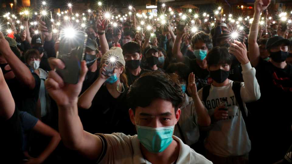 Pro-democracy protesters shine their mobile phone lights during an anti-government protest, in Bangkok, Thailand October 18, 2020.