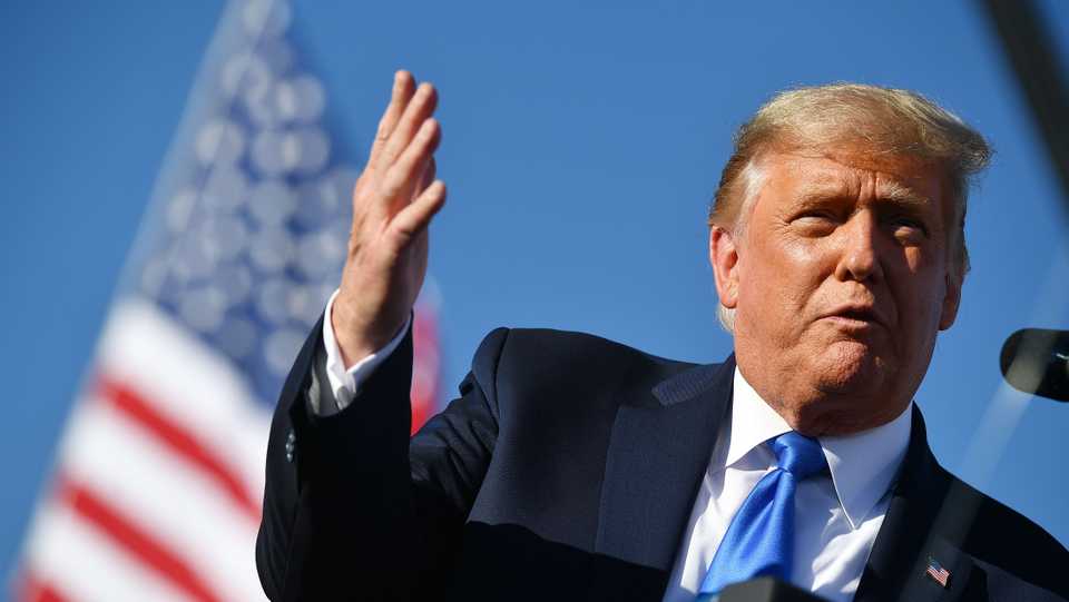 US President Donald Trump gestures as he speaks during a rally at Carson City Airport in Carson City, Nevada on October 18, 2020.