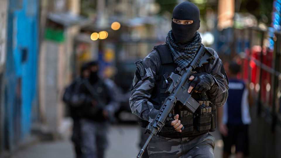 Members of the Brazilian Military Police special unit, Choque, patrol during an operation in the Rocinha favela in Rio de Janeiro, Brazil. File photo: March 26, 2018.