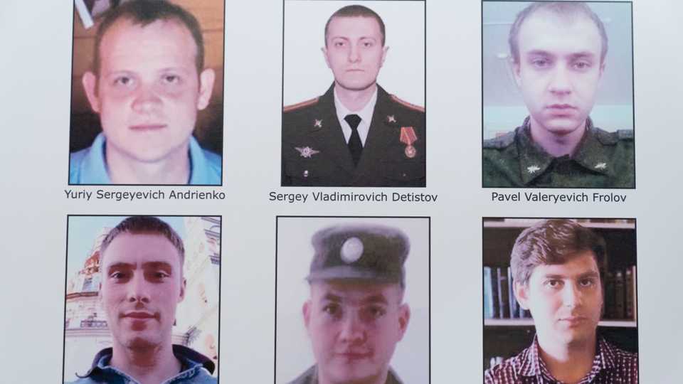A poster showing six wanted Russian military intelligence officers is displayed at the Department of Justice, October 19, 2020, in Washington, DC, US.