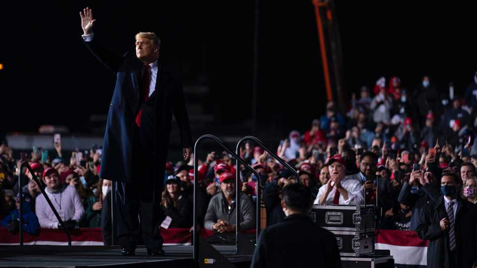 President Donald Trump waves as he walks off stage after a campaign rally at Erie International Airport, Tom Ridge Field, Tuesday, October 20, 2020, in Erie, Pennsylvania.
