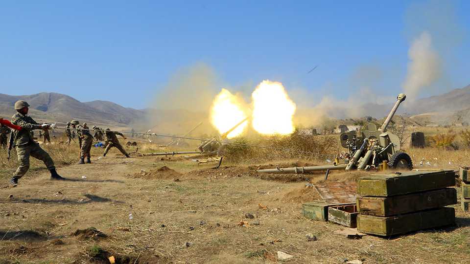An image shared by the Azerbaijan Defence Ministry shows howitzers firing munitions towards Armenian positions during a counter operation on October 20, 2020.