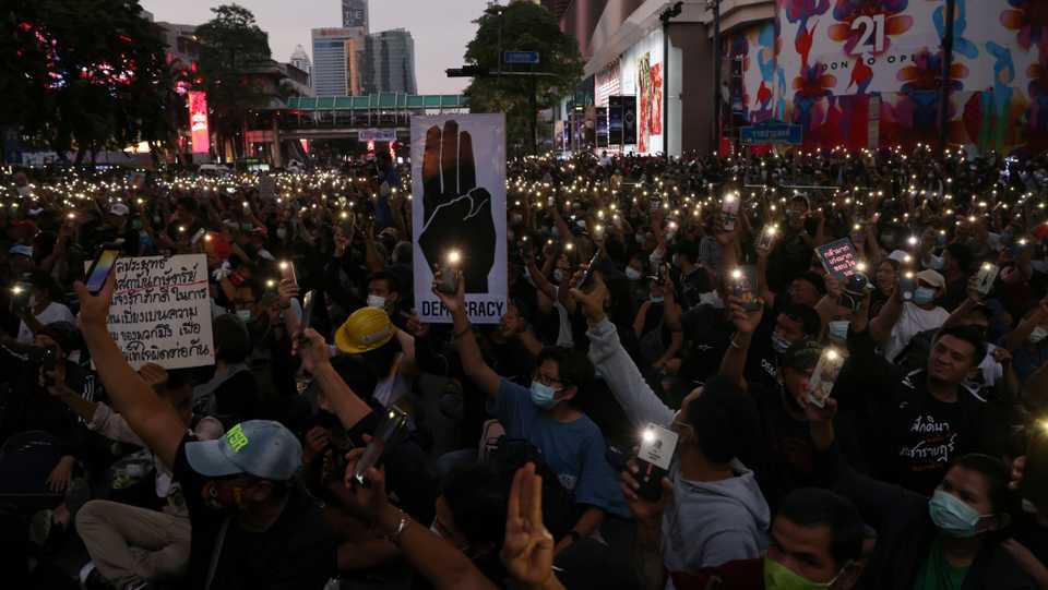 Thai protesters flash lights from their phones during a protest in Bangkok, Thailand October 25, 2020.