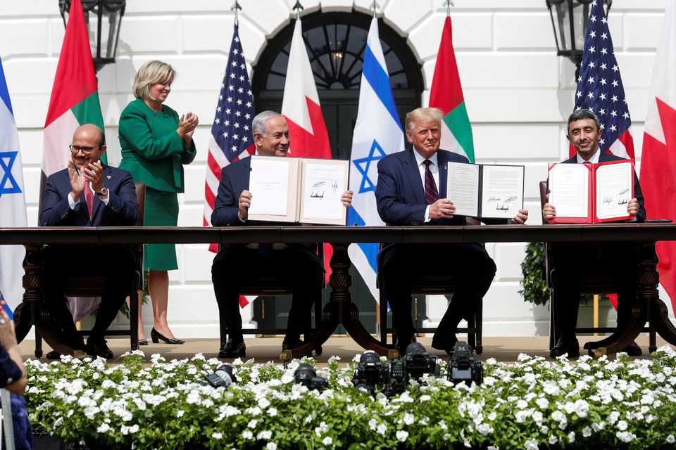 Bahrain’s Foreign Minister Abdullatif Al Zayani, Israel's Prime Minister Benjamin Netanyahu, US President Donald Trump and United Arab Emirates (UAE) Foreign Minister Abdullah bin Zayed participate in the signing of the Abraham Accords, normalizing relations between Israel and some of its Middle East neighbors in a strategic realignment of Middle Eastern countries against Iran, on the South Lawn of the White House in Washington, U.S., September 15, 2020.