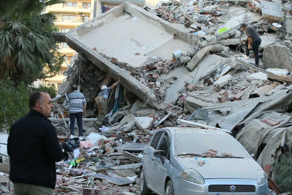 Search and rescue works continue working at the debris of a building in Bayrakli district after a magnitude 6.6 quake shook Turkey's Aegean Sea coast, in Izmir, Turkey on October 30, 2020.