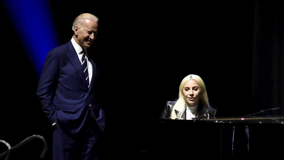 U.S. Vice President Joe Biden looks on as singer Lady Gaga speaks during an event to bring awareness to sexual assault on college campuses in Las Vegas, Nevada April 7, 2016