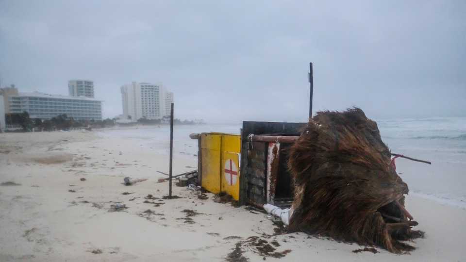 A lifeguard tower lays on its side after it was toppled over by Hurricane Delta in Cancun, Mexico, early Wednesday, Oct. 7, 2020