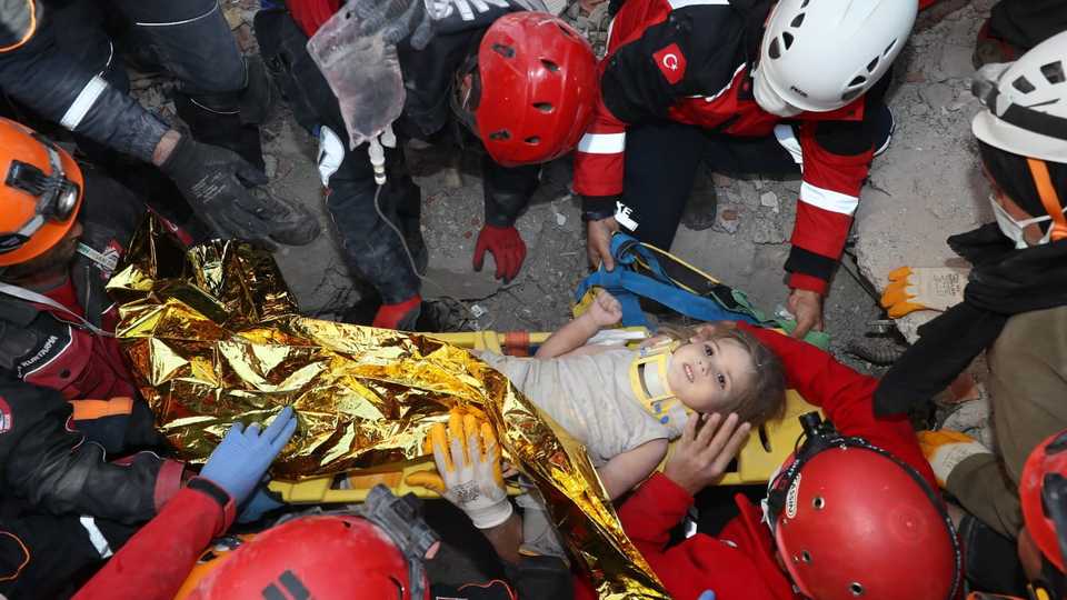 Four-year-old Ayla Gezgin, is being pulled from the debris of Riza Bey apartment, 91 hours after a magnitude 6.6 quake shook Turkey's Aegean Sea coast, in Izmir, Turkey on November 03, 2020.
