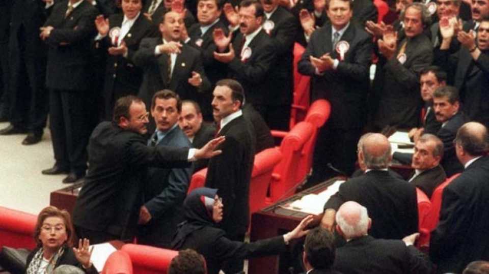 Soon after Merve Kavakci entered the Turkish Parliament secular DSP lawmakers prevented her taking the oath. 