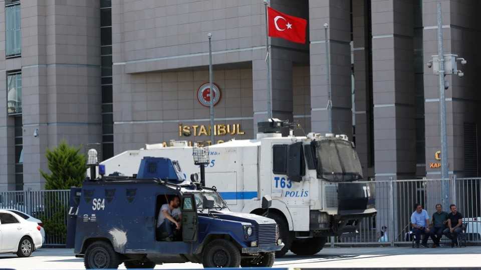 Police vehicles are seen during the trial of Cumhuriyet Daily suspects who are accused of supporting a terrorist group outside a courthouse, in Istanbul, Turkey, July 24, 2017.