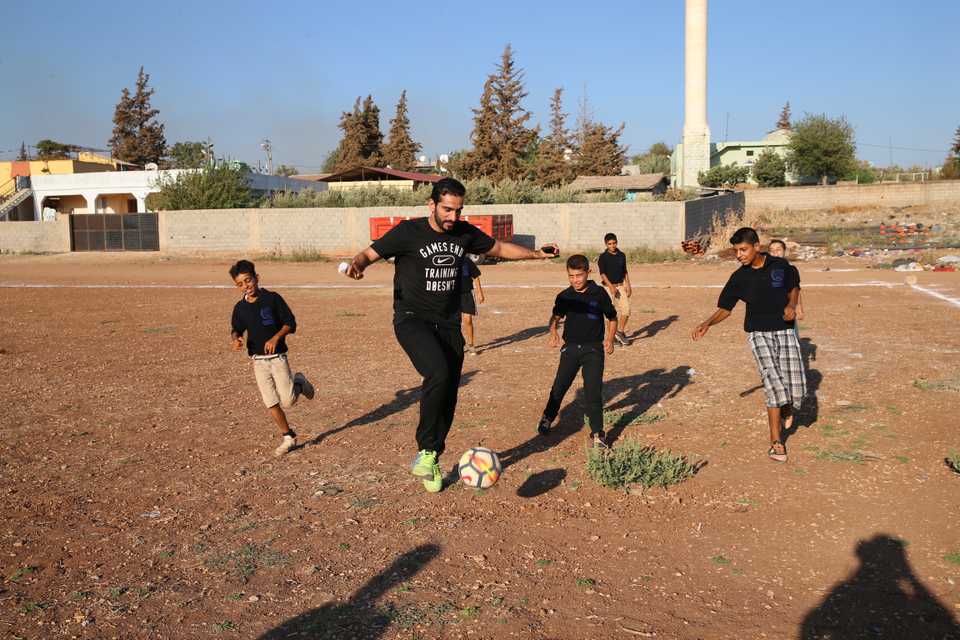 Qatari footballer Adel Lamy seen playing football with Syrian children in Turkeys Reyhanli district. 