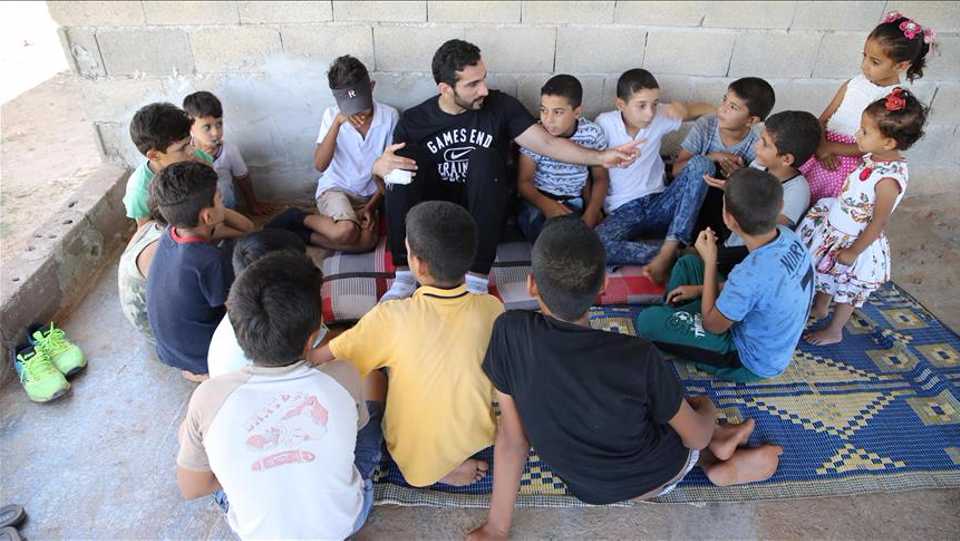 Qatar footballer Adel Lamy meets with Syrian children in Turkeys Hatay province.