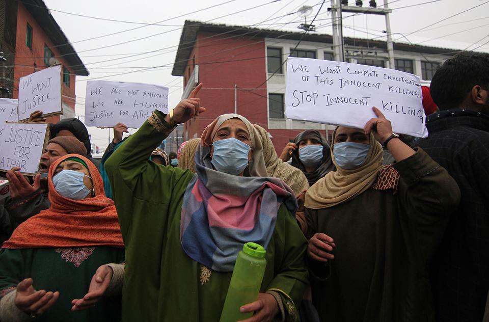 Family members of the youth killed in Lawaypora stage a protest in Srinagar on January 04, 2021, demanding the bodies of their relatives. Indian police claimed that three militants were killed in the gunfight but the families contested the claims and pleaded that their sons were innocent.