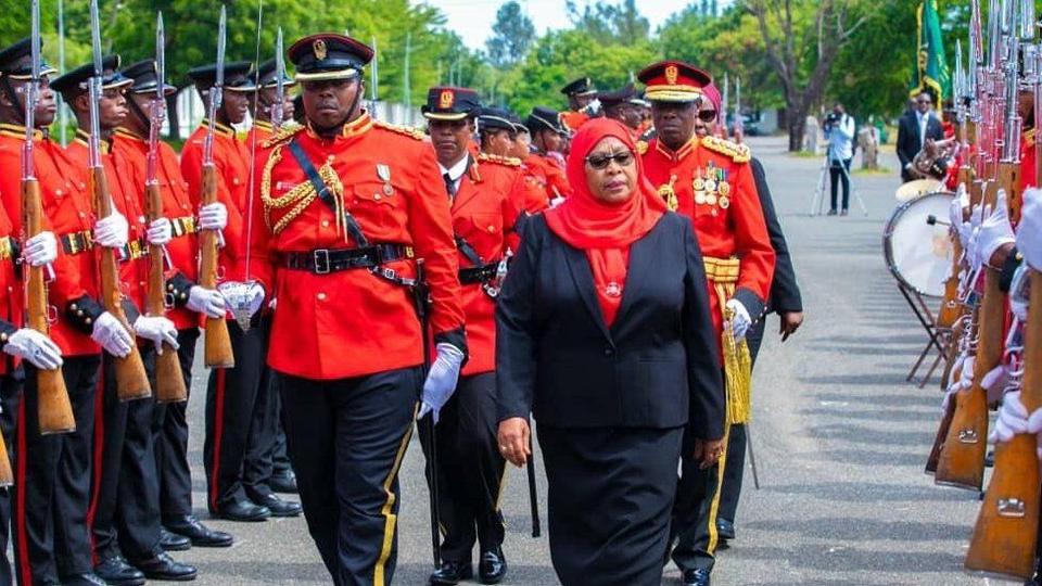 President Samia inspects a guard of honour after being sworn in as the sixth president of Tanzania.