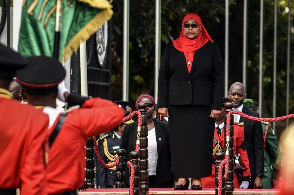 The 61-year-old, dressed in black suit and red headscarf, took the oath of office in Dar es Salaam.