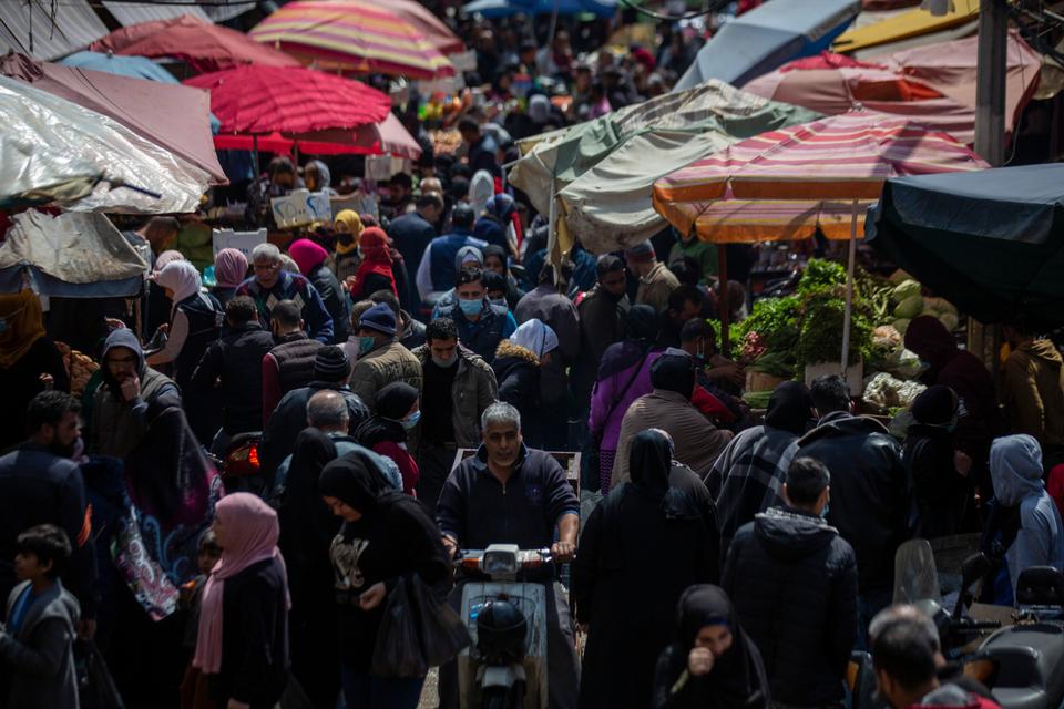 People shop at a market in preparation for Ramadan in Beirut, Lebanon, April 12, 2021.