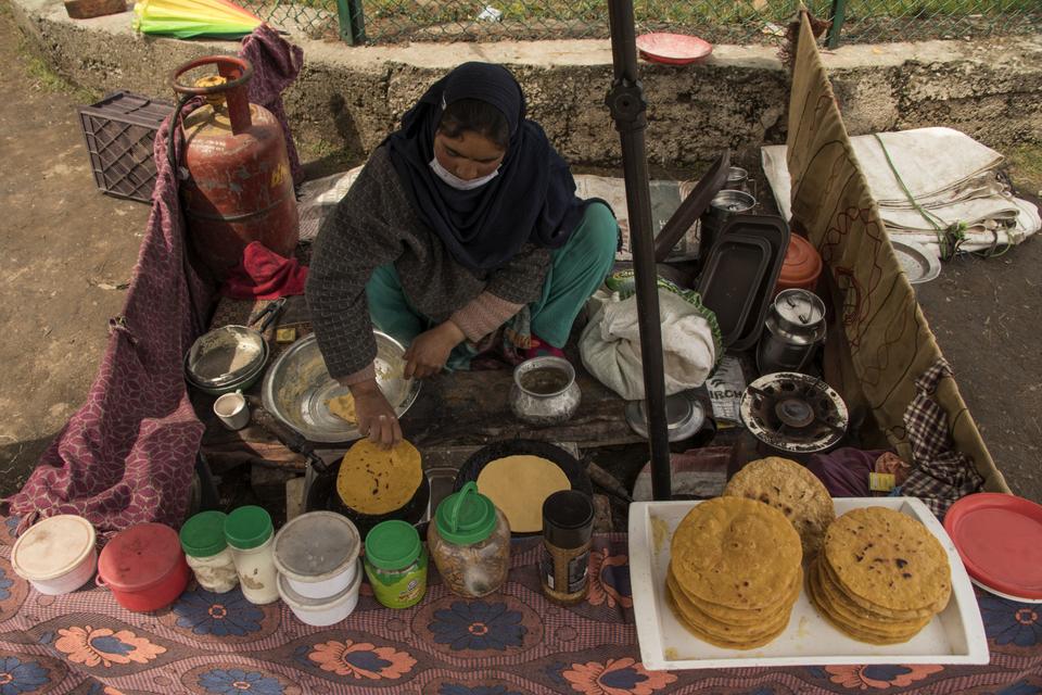The street court where Kashmiri women tea-sellers prepare and serve tea along with Kashmiri bread.
