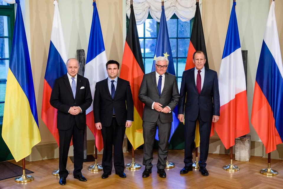 French Foreign Minister Laurent Fabius, Ukrainian Foreign Minister Pavlo Klimkin, German Foreign Minister Frank-Walter Steinmeier and Russian Foreign Minister Sergey Lavrov, from left, pose for a group photo in Berlin, on April 13, 2015 before their meeting to discuss implementation of the peace agreement brokered in Minsk, Belarus in February.