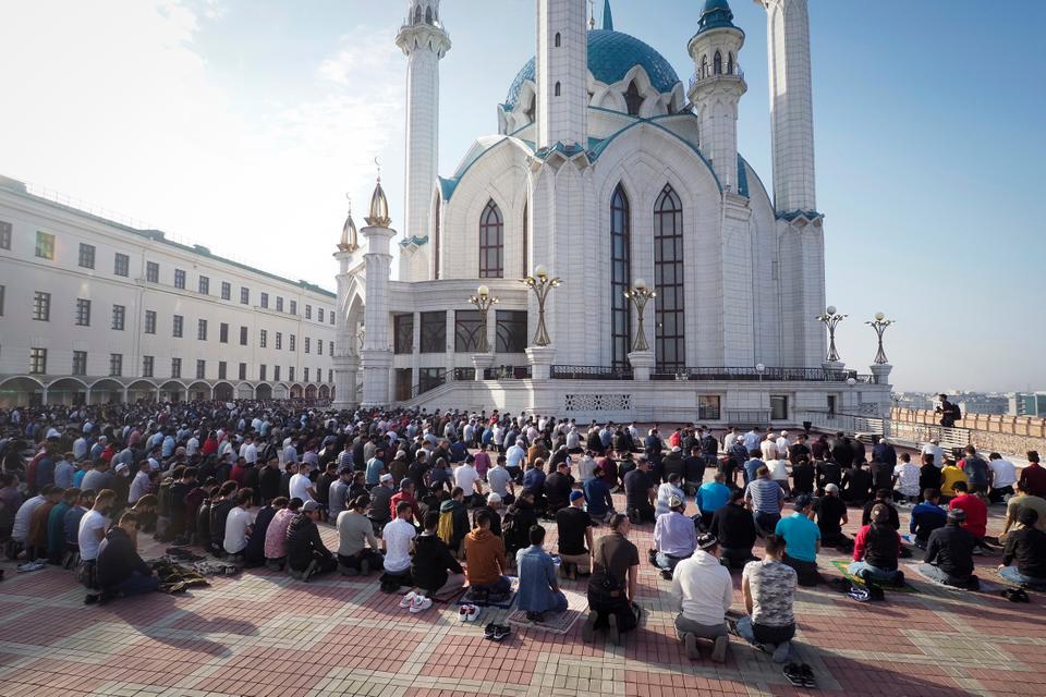 Muslims take part in Eid al Fitr prayers at the Kul Sharif Mosque in Kazan, Russia.