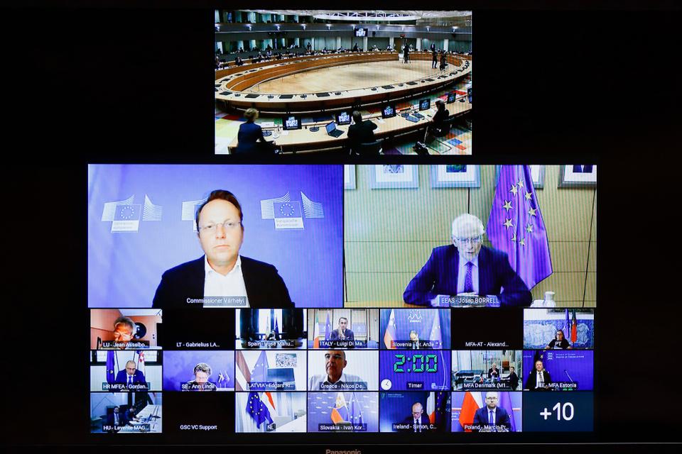 European Union foreign policy chief Josep Borrell, screen middle right, speaks with EU foreign ministers and representatives as he takes part in an extraordinary Foreign Affairs Council, via video link, at the European Council building in Brussels on August 17, 2021.