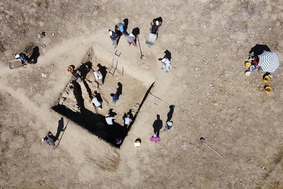 An aerial view taken on September 21, 2021 shows archaeologists working of the site of the 