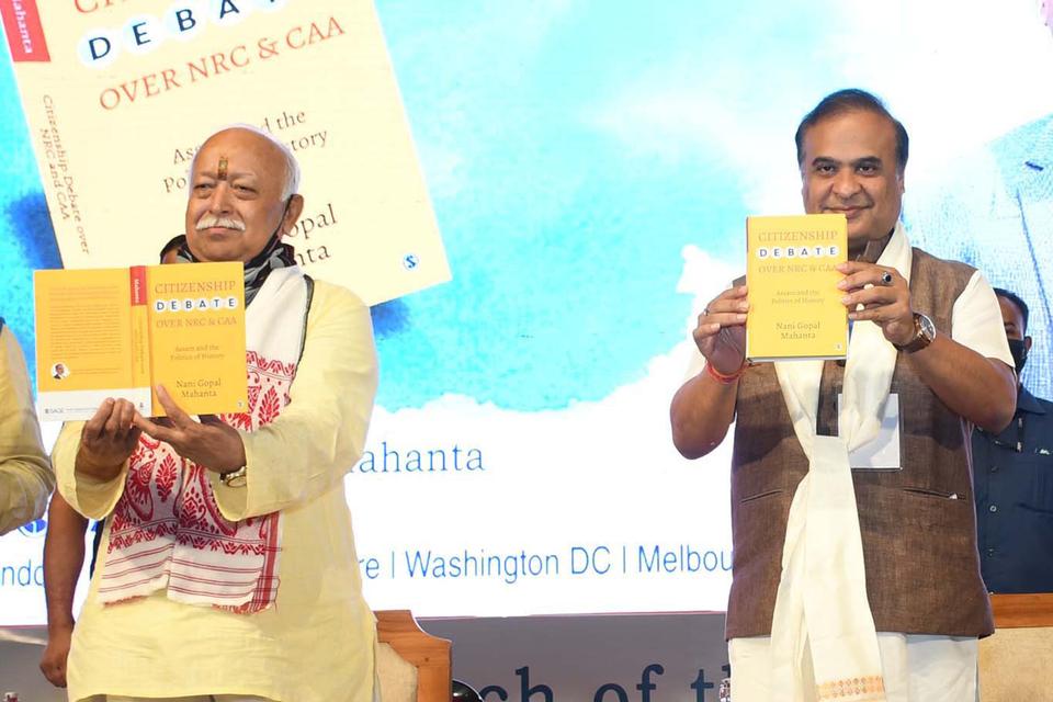 RSS Chief Mohan Bhagwat, left, with Himanta Biswa Sarma at the NRC & CAA Debate Book Launch Ceremony in Guwahati, India on July 21, 2021.