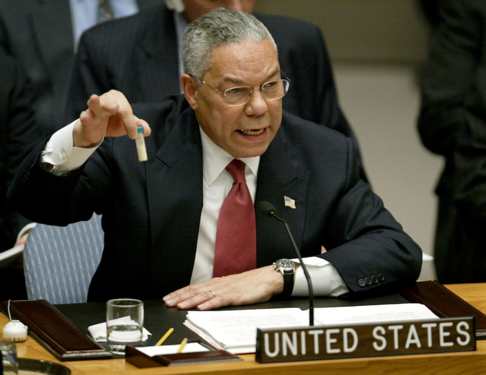 US Secretary of State Colin Powell holds up a vial that he said could contain anthrax as he presents evidence of Iraq's alleged weapons programs to the United Nations Security Council, Feb. 5, 2003.
