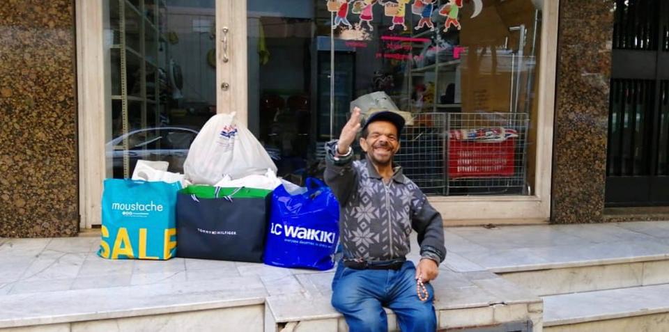 Abu Ali was the first person to come to Cherine's store.  He left him happy and wearing a hat and shirt.