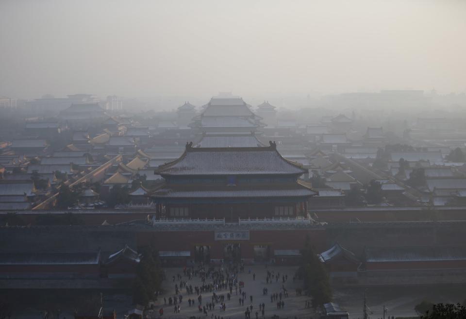 The Forbidden City is seen from the top of Jingshan Park during a heavily polluted day in Beijing, China, November 29, 2015.