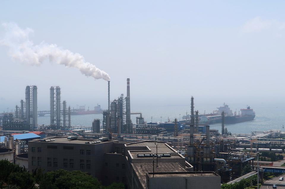 China National Petroleum Corporation (CNPC)'s Dalian Petrochemical Corp refinery is seen near the downtown of Dalian in Liaoning province, China July 17, 2018.