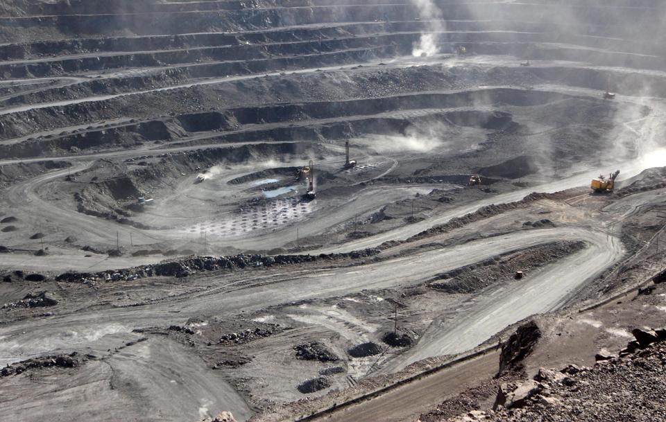 Miners are seen at the Bayan Obo mine containing rare earth minerals, in Inner Mongolia, China.