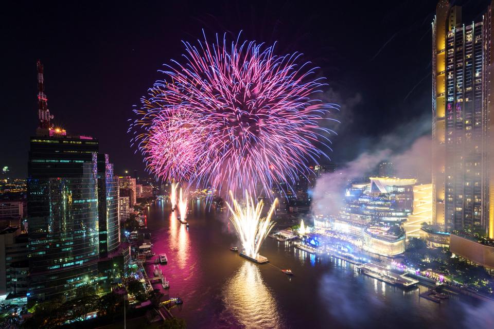 Fireworks exploded on the Chao Phraya River during the New Year celebrations in Bangkok, Thailand.