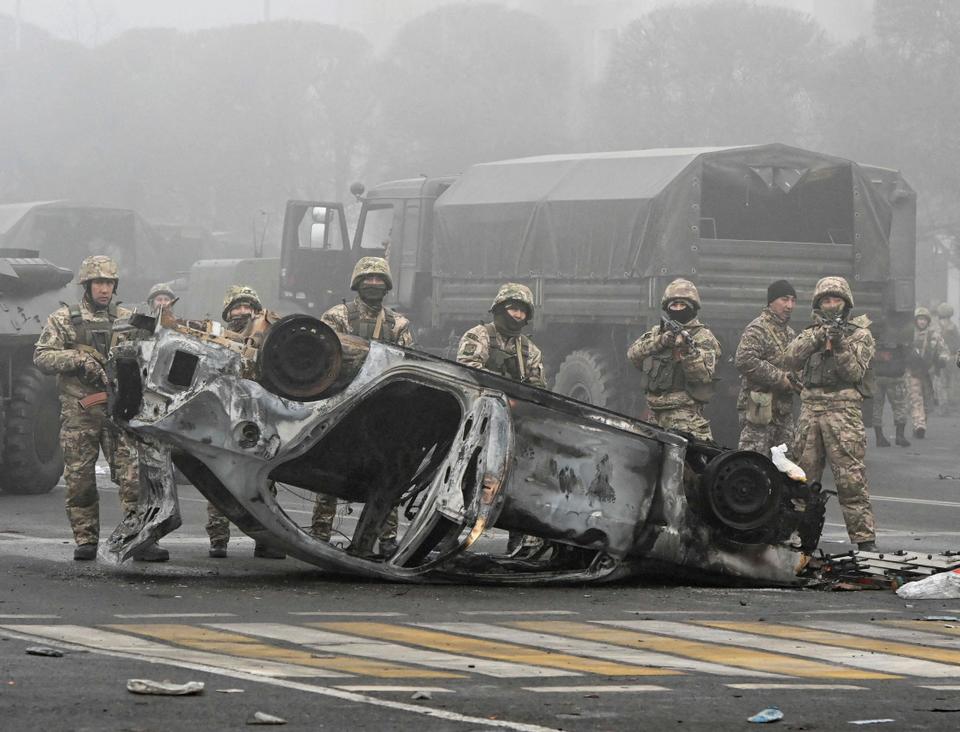 Troops are seen at the main square where hundreds of people were protesting against the government, after authorities' decision to lift price caps on liquefied petroleum gas, in Almaty, Kazakhstan .