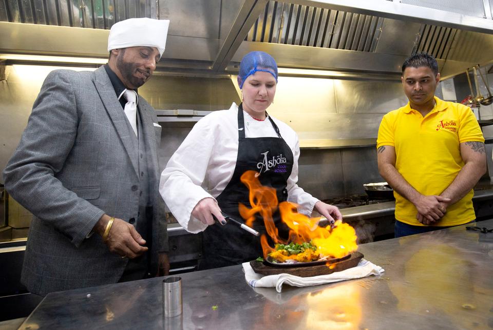 Liberal Democrat leader Jo Swinson helps make a chicken tikka masala during a visit to the Ashoka restaurant in Bearsden, Glasgow, during the General Election campaign, in Scotland in late 2019.