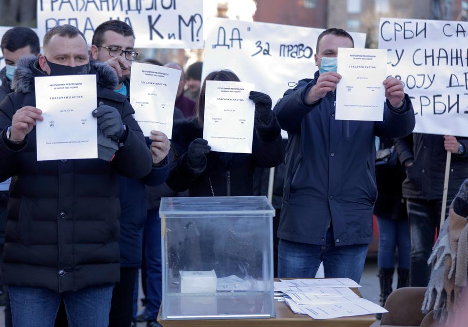 Dozens of Serbs have protested the ban on ethnic Serbs who vote for Kosovo in a Serbian referendum on constitutional amendment.
