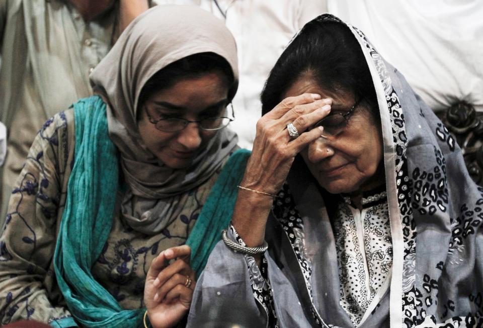 Fauzia Siddiqui, left, sister of Aafia Siddiqui sits with her mother Ismat Siddiqui after an announcement of the verdict against Aafia, in 2010 in Karachi, Pakistan.