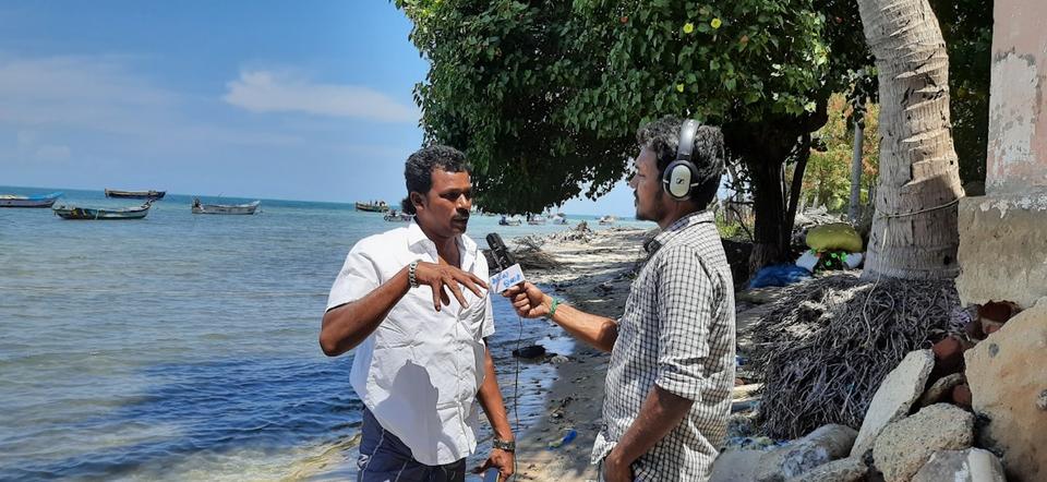 The Kadal Osai Radio Jockey (RJ) interviewing a native in Pamban island. The 24/7 channel provides timely weather updates for fishermen.