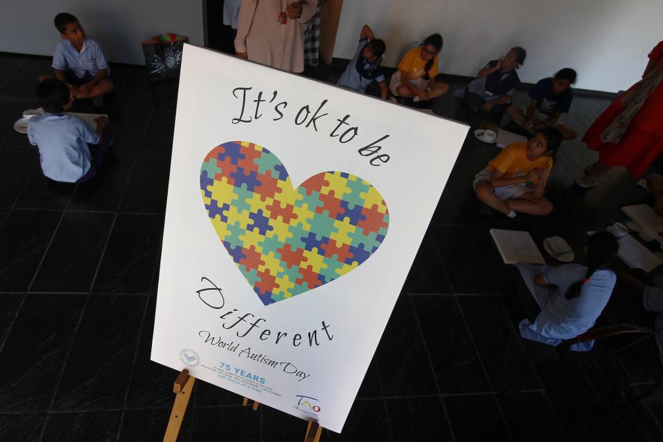 Children participate in drawing activities during the celebration of World Autism Awareness Day (WAAD) in Mumbai, India in 2019.