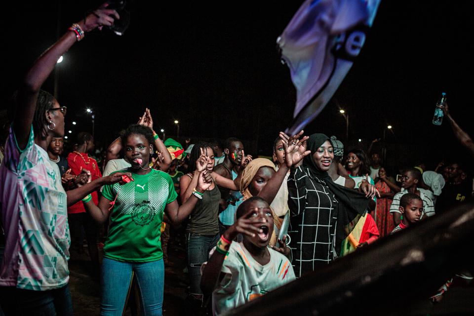 Crowds erupt at the HLM Grand Yoff neighborhood of Dakar a few moments after Senegal was declared winner of the 2022 African Cup of Nations.