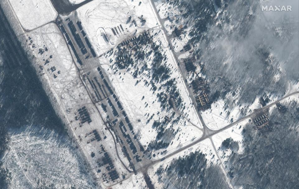 A satellite image shows troops and equipment deployments at Zyabrovka air base in Belarus. (Satellite image ©2022 Maxar Technologies via AP)