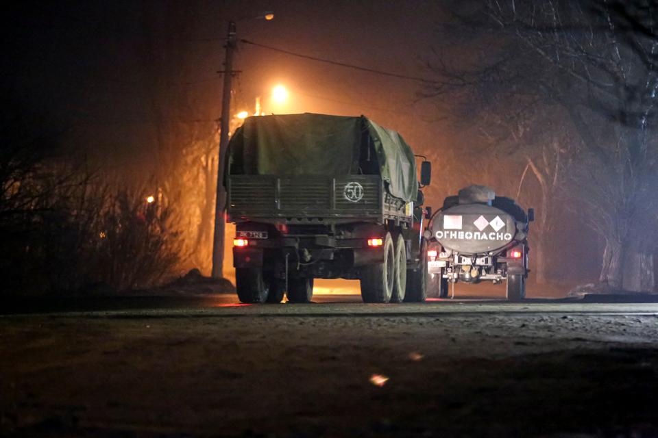 Military trucks move down a street outside Donetsk, the territory controlled by pro-Russian militants, in eastern Ukraine on Tuesday.