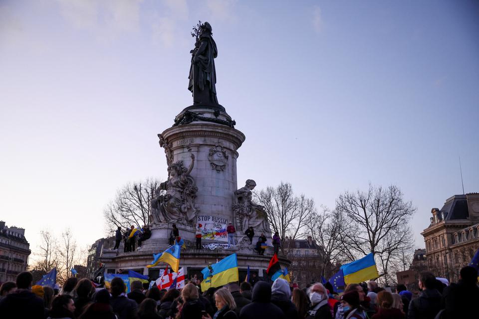 People attend a protest at the Place de la Republique in Paris, France.